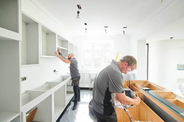 Upgrade Modern Home renovation team reviewing plans inside a home