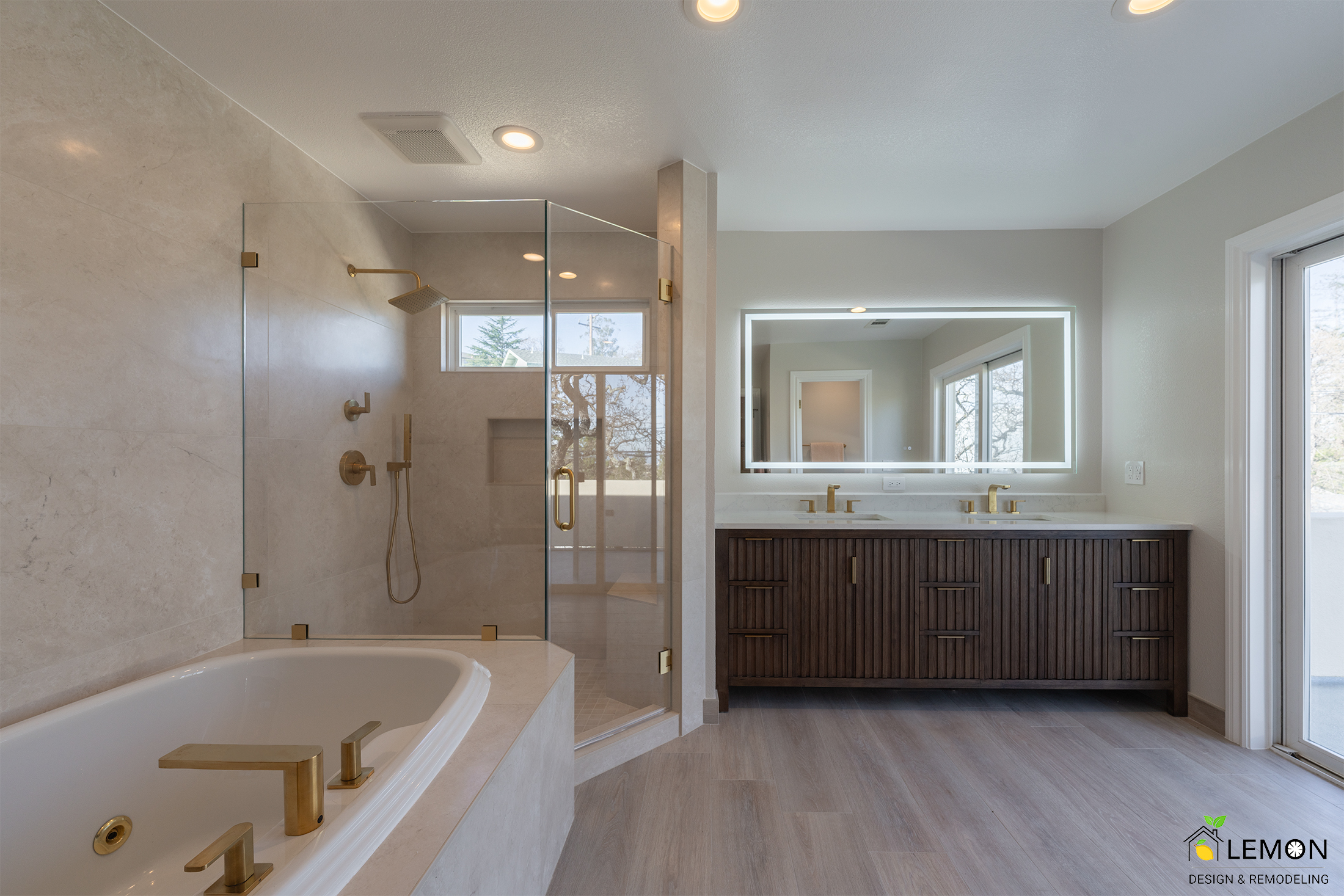 Luxurious remodeled bathroom with walk-in glass shower